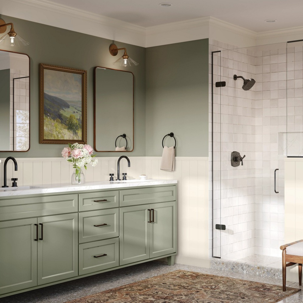 Green cabinetry in a bathroom with walk-in shower